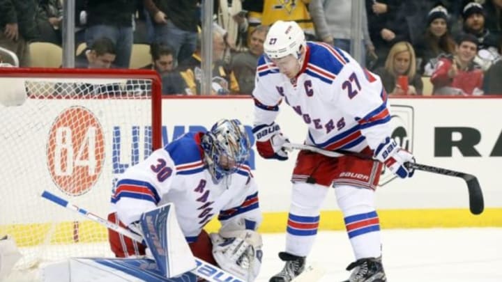 Mar 3, 2016; Pittsburgh, PA, USA; New York Rangers goalie Henrik Lundqvist (30) and defenseman Ryan McDonagh (27) talk after the two collided against the Pittsburgh Penguins during the second period at the CONSOL Energy Center. The Penguins won 4-1. Mandatory Credit: Charles LeClaire-USA TODAY Sports