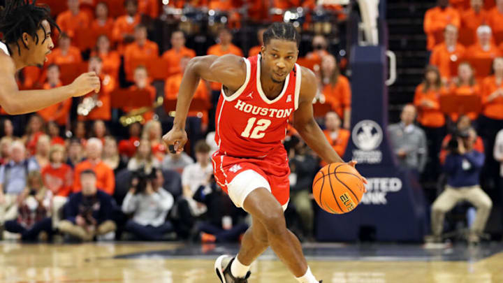 CHARLOTTESVILLE, VA - DECEMBER 17: Tramon Mark #12 of the Houston Cougars dribbles in the first half during a game against the Virginia Cavaliers at John Paul Jones Arena on December 17, 2022 in Charlottesville, Virginia. (Photo by Ryan M. Kelly/Getty Images)