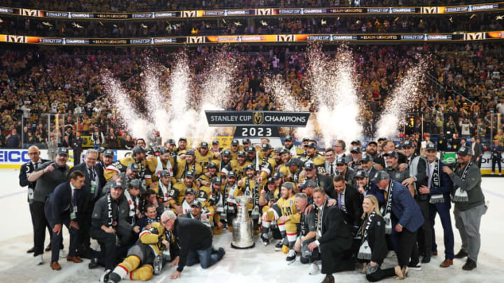 LAS VEGAS, NEVADA - JUNE 13: Members of the Vegas Golden Knights pose with the Stanley Cup after defeating the Florida Panthers to win the championship in Game Five of the 2023 NHL Stanley Cup Final at T-Mobile Arena on June 13, 2023 in Las Vegas, Nevada. (Photo by Christian Petersen/Getty Images)