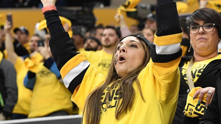 A Pittsburgh Penguins fan hoists the cup. (Photo by Justin Berl/Getty Images)