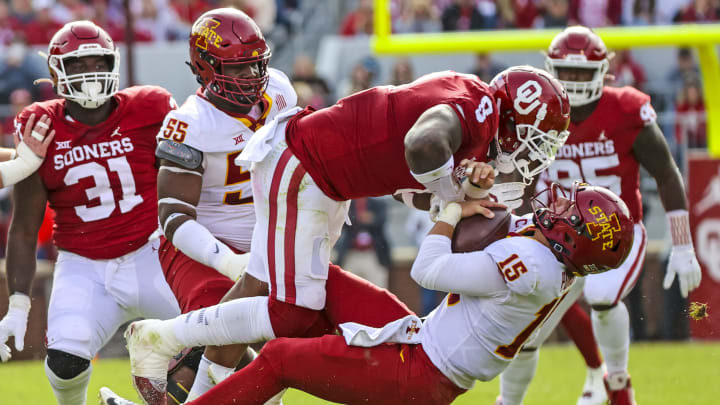 Nov 20, 2021; Norman, Oklahoma, USA; Oklahoma Sooners defensive lineman Perrion Winfrey (8) tackles Iowa State Cyclones quarterback Brock Purdy (15) during the first quarter at Gaylord Family-Oklahoma Memorial Stadium. Mandatory Credit: Kevin Jairaj-USA TODAY Sports