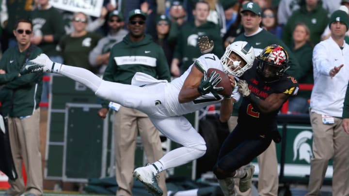 COLLEGE PARK, MD - NOVEMBER 03: Cody White #7 of the Michigan State Spartans catches a pass against RaVon Davis #2 of the Maryland Terrapins during the first half at Capital One Field on November 3, 2018 in College Park, Maryland. (Photo by Will Newton/Getty Images)