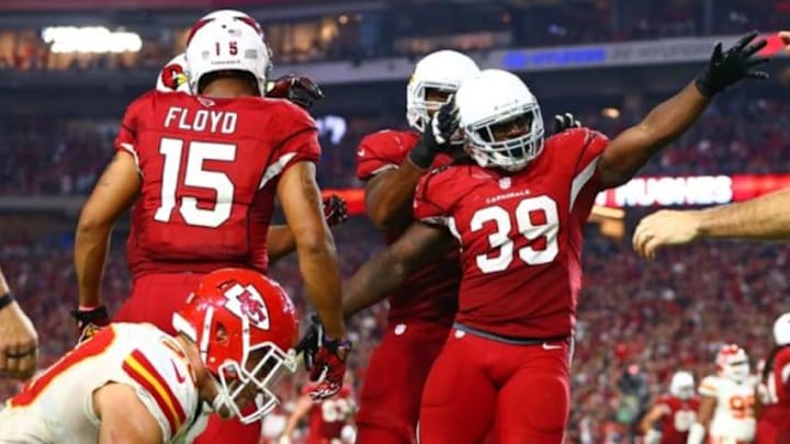 Dec 7, 2014; Glendale, AZ, USA; Arizona Cardinals running back Robert Hughes (39) celebrates a fourth quarter first down against the Kansas City Chiefs at University of Phoenix Stadium. The Cardinals defeated the Chiefs 17-14. Mandatory Credit: Mark J. Rebilas-USA TODAY Sports