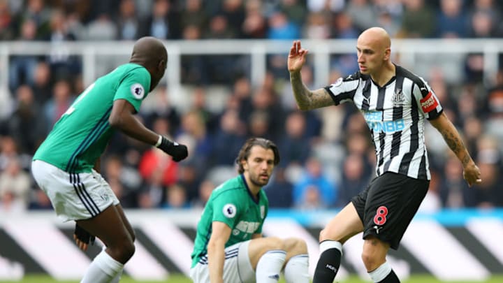 NEWCASTLE UPON TYNE, ENGLAND - APRIL 28: Jonjo Shelvey of Newcastle United is challenged by Allan Nyom of West Bromwich Albion during the Premier League match between Newcastle United and West Bromwich Albion at St. James Park on April 28, 2018 in Newcastle upon Tyne, England. (Photo by Alex Livesey/Getty Images)