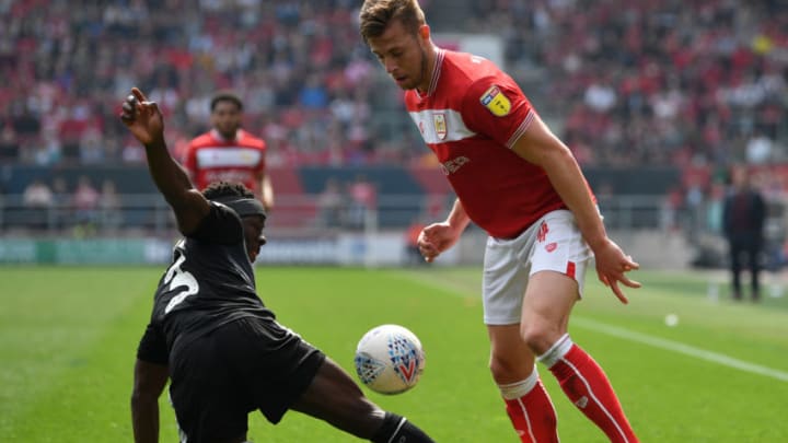 BRISTOL, ENGLAND - APRIL 19: Adam Webster of Bristol City in action while challenged by Andy Yiadom of Reading during the Sky Bet Championship match between Bristol City and Reading at Ashton Gate on April 19, 2019 in Bristol, England. (Photo by Dan Mullan/Getty Images)