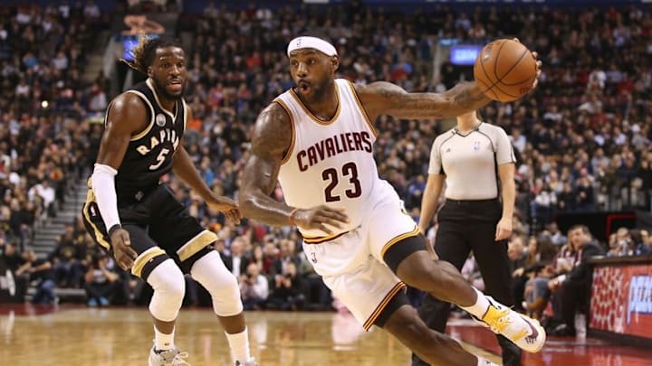 Nov 25, 2015; Toronto, Ontario, CAN; Cleveland Cavaliers forward LeBron James (23) goes to the basket past Toronto Raptors forward DeMarre Carroll (5) at Air Canada Centre. Mandatory Credit: Tom Szczerbowski-USA TODAY Sports