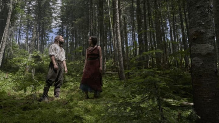 Rene Sel (Christian Cooke) and Mari (Kaniehtiio Horn) pause in the woods. (National Geographic/Peter H. Stranks)