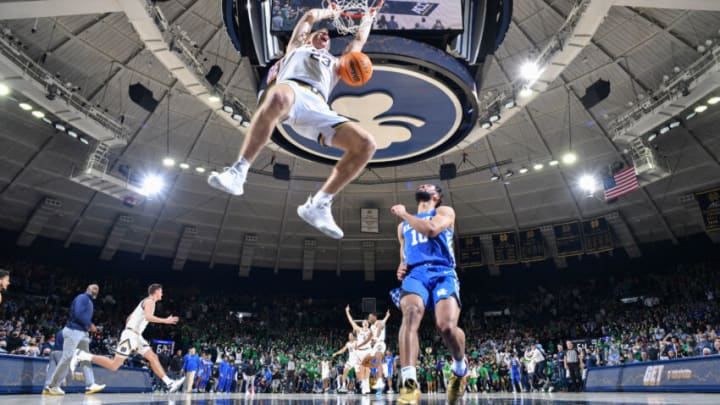 Dec 11, 2021; South Bend, Indiana, USA; Notre Dame Fighting Irish guard Dane Goodwin (23) dunks in front of Kentucky Wildcats guard Davion Mintz (10) as time expires in the second half at the Purcell Pavilion. Mandatory Credit: Matt Cashore-USA TODAY Sports