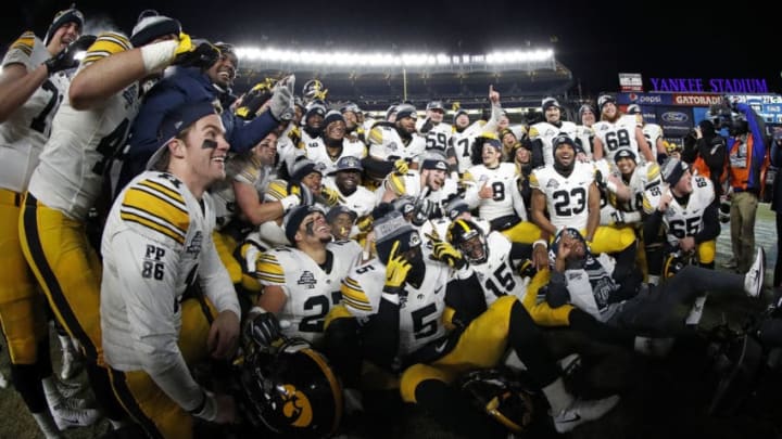 NEW YORK, NY - DECEMBER 27: The Iowa Hawkeyes celebrate after defeating the Boston College Eagles in the New Era Pinstripe Bowl at Yankee Stadium on December 27, 2017 in the Bronx borough of New York City. The Iowa Hawkeyes won 27-20. (Photo by Adam Hunger/Getty Images)