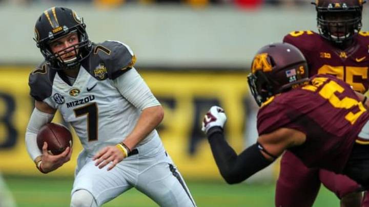 Jan 1, 2015; Orlando, FL, USA; Missouri Tigers quarterback Maty Mauk (7) is flushed out of the pocket by Minnesota Golden Gophers linebacker Damien Wilson (5) during the first half in the 2015 Citrus Bowl at Florida Citrus Bowl. Mandatory Credit: Jim Dedmon-USA TODAY Sports
