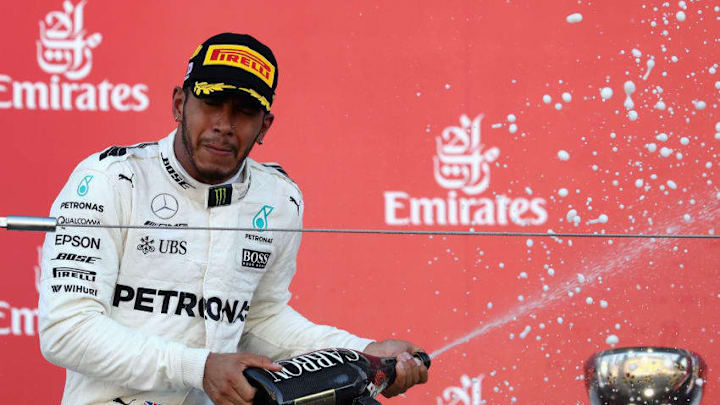 SUZUKA, JAPAN - OCTOBER 08: Race winner Lewis Hamilton of Great Britain and Mercedes GP celebrates on the podium during the Formula One Grand Prix of Japan at Suzuka Circuit on October 8, 2017 in Suzuka. (Photo by Mark Thompson/Getty Images)