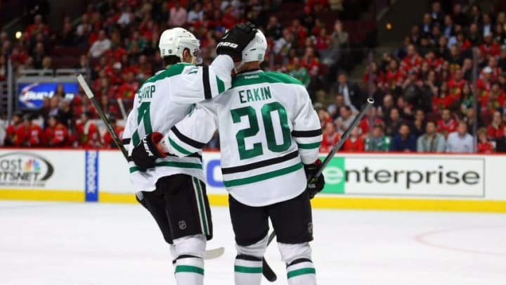 Mar 22, 2016; Chicago, IL, USA; Dallas Stars center Cody Eakin (20) is congratulated for scoring by left wing Patrick Sharp (10) during the third period against the Chicago Blackhawks at the United Center. Dallas won 6-2. Mandatory Credit: Dennis Wierzbicki-USA TODAY Sports
