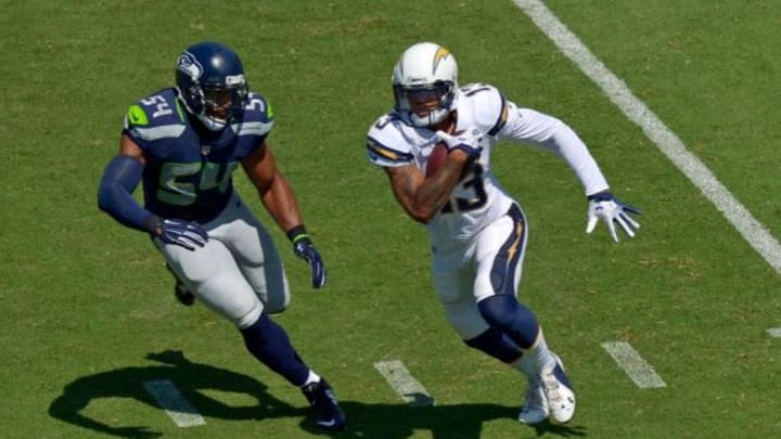 Sep 14, 2014; San Diego, CA, USA; San Diego Chargers wide receiver Keenan Allen (13) runs after making a catch as Seattle Seahawks middle linebacker Bobby Wagner (54) defends during the first quarter at Qualcomm Stadium. Mandatory Credit: Jake Roth-USA TODAY Sports