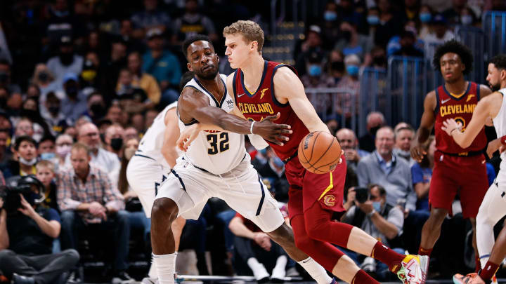 Cleveland Cavaliers forward Lauri Markkanen (24) dribbles the ball under pressure from Denver Nuggets forward Jeff Green (32) in the first quarter at Ball Arena on 25 Oct. 2021. (Isaiah J. Downing-USA TODAY Sports)