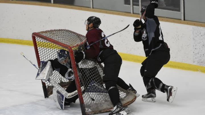 CENTENNIAL, CO - SEPTEMBER 23: Rene Bourque (24) of the Colorado Avalanche is checked into the net by Duncan Siemens (15) as Nathan Lieuwn (35) takes cover during the first day of training camp at Family Sports Ice Arena in Centennial, Colorado on September 23, 2016. (Photo by Seth McConnell/The Denver Post via Getty Images)