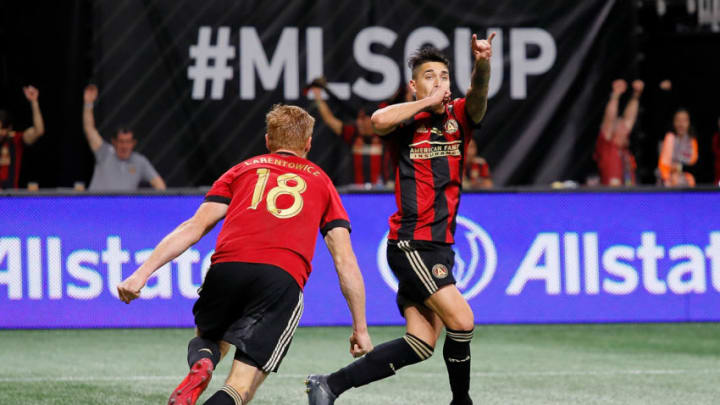 ATLANTA, GA - DECEMBER 08: Franco Escobar #2 of Atlanta United celebrates after scoring the second goal past goalkeeper Jeff Attinella #1 of Portland Timbers in the second half with Jeff Larentowicz #18 during the 2018 MLS Cup between Atlanta United and the Portland Timbers at Mercedes-Benz Stadium on December 8, 2018 in Atlanta, Georgia. (Photo by Kevin C. Cox/Getty Images)