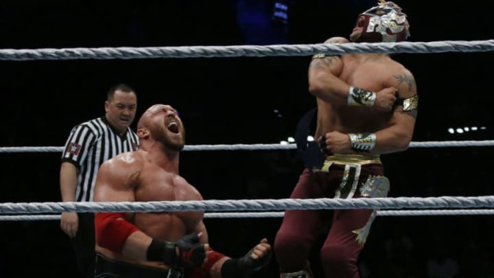 Wrestlers Ryback and Kalisto fight during a show at the AccorHotels Arena in Paris, as part of the WrestleMania Revenge Tour, the World Wrestling Entertainment (WWE) European tour, on April 22, 2016. / AFP / THOMAS SAMSON (Photo credit should read THOMAS SAMSON/AFP via Getty Images)