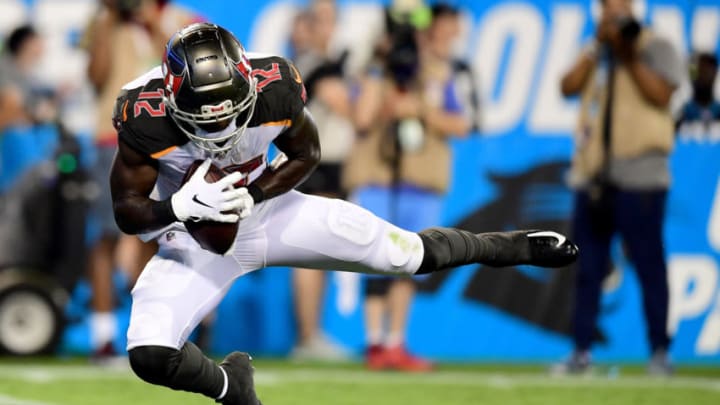 CHARLOTTE, NORTH CAROLINA - SEPTEMBER 12: Chris Godwin #12 of the Tampa Bay Buccaneers scores a touchdown in the second quarter during their game against the Carolina Panthers at Bank of America Stadium on September 12, 2019 in Charlotte, North Carolina. (Photo by Jacob Kupferman/Getty Images)