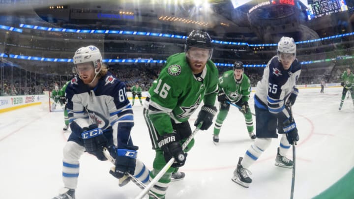Feb 23, 2022; Dallas, Texas, USA; Winnipeg Jets left wing Kyle Connor (81) and center Mark Scheifele (55) and Dallas Stars center Joe Pavelski (16) fight for the puck during the third period at the American Airlines Center. Mandatory Credit: Jerome Miron-USA TODAY Sports