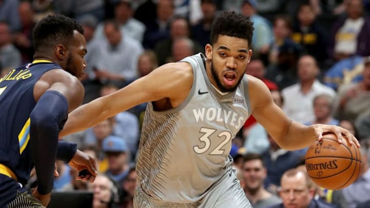 DENVER, CO - APRIL 05: Karl-Anthony Towns #32 of the Minnesota Timberwolves drives to the basket against Paul Millsap #4 of the Denver Nuggets at the Pepsi Center on April 5, 2018 in Denver, Colorado. (Photo by Matthew Stockman/Getty Images)
