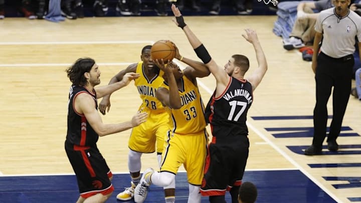 Apr 21, 2016; Indianapolis, IN, USA; Indiana Pacers center Myles Turner (33) takes a shot against Toronto Raptors center Jonas Valanciunas (17) in the second half in game three of the first round of the 2016 NBA Playoffs at Bankers Life Fieldhouse. Toronto defeated Indiana 101-85. Mandatory Credit: Brian Spurlock-USA TODAY Sports