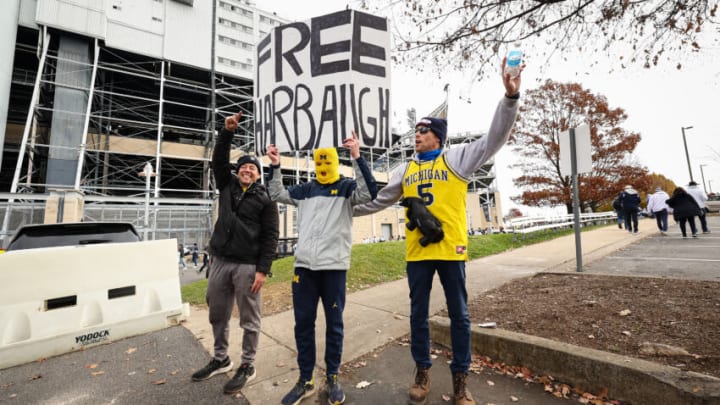 STATE COLLEGE, PA - NOVEMBER 11: Michigan Wolverines fans hold a sign after the suspension of head coach Jim Harbaugh of the Michigan Wolverines is announced before the game against the Penn State Nittany Lions Beaver Stadium on November 11, 2023 in State College, Pennsylvania. (Photo by Scott Taetsch/Getty Images)