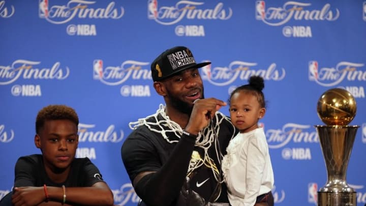 June 19, 2016; Oakland, CA, USA; Cleveland Cavaliers forward LeBron James (23) speaks to media with his children Lebron James Jr. and Zhuri James present following the 93-89 victory against the Golden State Warriors in game seven of the NBA Finals at Oracle Arena. Mandatory Credit: Kelley L Cox-USA TODAY Sports