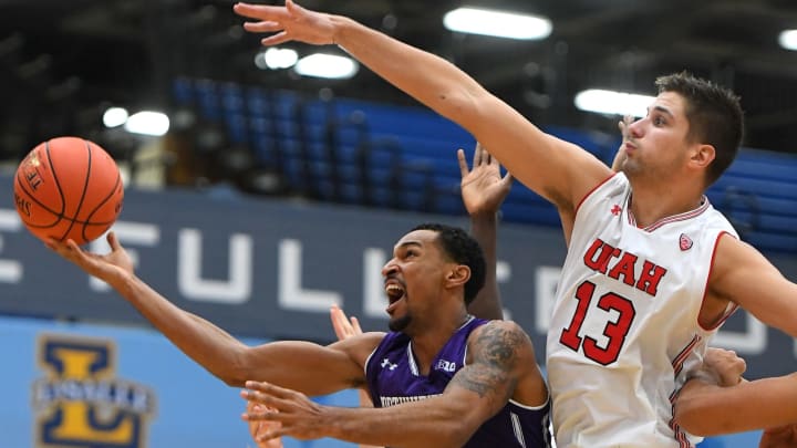 FULLERTON, CA – NOVEMBER 25: Ryan Taylor #14 of the Northwestern Wildcats goes for a basket as Parker Van Dyke #5 and Novak Topalovic #13 of the Utah Utes defend in the second half of the game during the Wooden Legacy Tournament at Titan Gym on November 25, 2018 in Fullerton, California. (Photo by Jayne Kamin-Oncea/Getty Images)