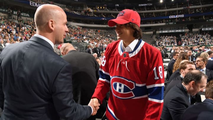 DALLAS, TX - JUNE 23: Alexander Romanov meets a member of the Montreal Canadiens draft personnel after being selected 38th overall by the Montreal Canadiens during the 2018 NHL Draft at American Airlines Center on June 23, 2018 in Dallas, Texas. (Photo by Brian Babineau/NHLI via Getty Images) DALLAS, TX - JUNE 23: Alexander Romanov meets a member of the Montreal Canadiens draft personnel after being selected 38th overall by the Montreal Canadiens during the 2018 NHL Draft at American Airlines Center on June 23, 2018 in Dallas, Texas. (Photo by Brian Babineau/NHLI via Getty Images)