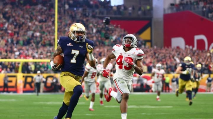 Jan 1, 2016; Glendale, AZ, USA; Notre Dame Fighting Irish wide receiver Will Fuller (7) runs for a touchdown against Ohio State Buckeyes linebacker Darron Lee (43) during the 2016 Fiesta Bowl at University of Phoenix Stadium. Mandatory Credit: Mark J. Rebilas-USA TODAY Sports