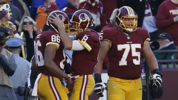 Nov 15, 2015; Landover, MD, USA; Washington Redskins tight end Jordan Reed (86) celebrates with Redskins quarterback Kirk Cousins (8) after scoring a touchdown against the New Orleans Saints in the first quarter at FedEx Field. Mandatory Credit: Geoff Burke-USA TODAY Sports