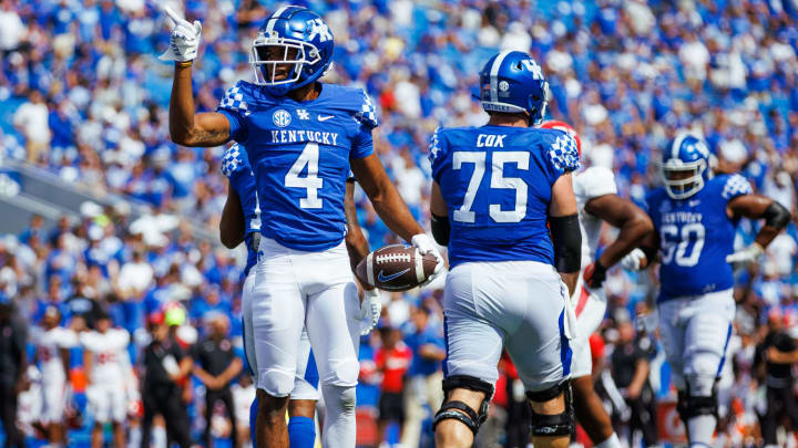 Sep 17, 2022; Lexington, Kentucky, USA; Kentucky Wildcats wide receiver DeMarcus Harris (4) celebrates during the fourth quarter against the Youngstown State Penguins at Kroger Field. Mandatory Credit: Jordan Prather-USA TODAY Sports