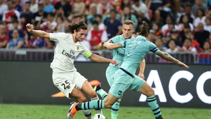 SINGAPORE - JULY 28: Hector Bellerin of Arsenal challenges Adrien Rabiot of Paris Saint Germain for the ball during the International Champions Cup match between Arsenal and Paris Saint Germain at the National Stadium on July 28, 2018 in Singapore. (Photo by Suhaimi Abdullah/Getty Images for ICC)