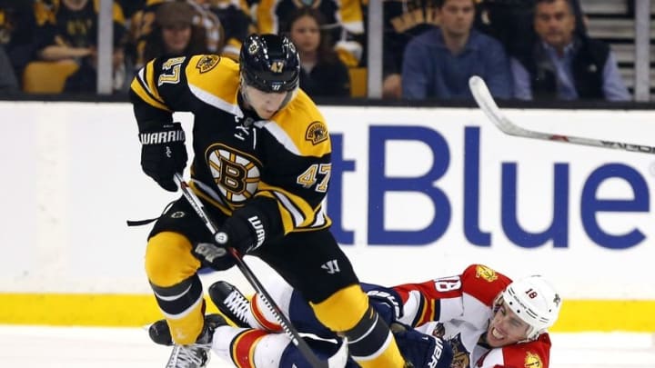 Mar 24, 2016; Boston, MA, USA; Boston Bruins defenseman Torey Krug (47) tries to keep the puck from Florida Panthers right wing Reilly Smith (18) during the first period at TD Garden. Mandatory Credit: Winslow Townson-USA TODAY Sports