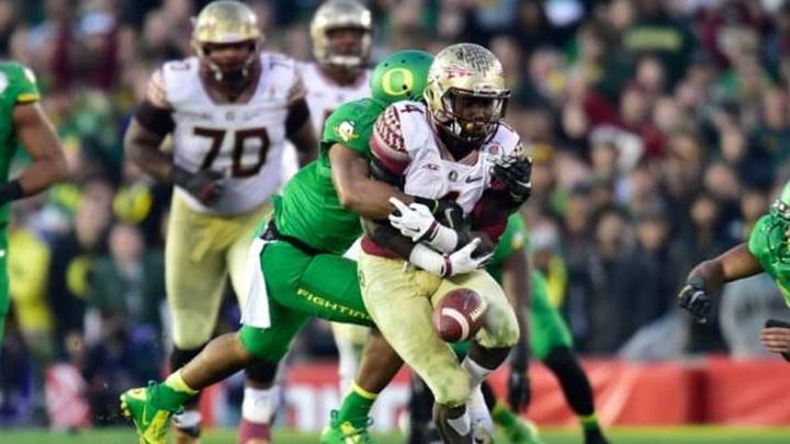 Jan 1, 2015; Pasadena, CA, USA; Oregon Ducks linebacker Johnny Ragin III (27) forces Florida State Seminoles running back Dalvin Cook (4) to fumble the football during the second half of the 2015 Rose Bowl college football game at Rose Bowl. Mandatory Credit: Robert Hanashiro-USA TODAY Sports