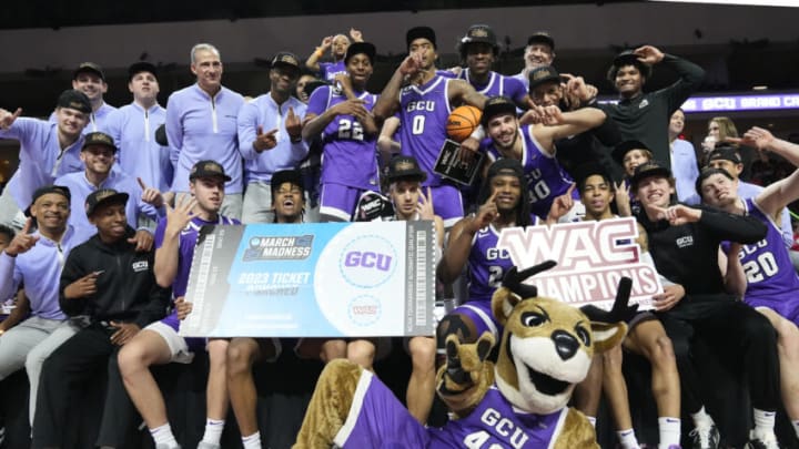 LAS VEGAS, NEVADA - MARCH 11: The Grand Canyon Antelopes pose for pictures following their win of the WAC Championship over the Southern Utah Thunderbirds during the Western Athletic Conference Basketball Tournament Championship game at the Orleans Arena on March 11, 2023 in Las Vegas, Nevada. The Antelopes defeated the Thunderbirds 84-66. (Photo by Louis Grasse/Getty Images)