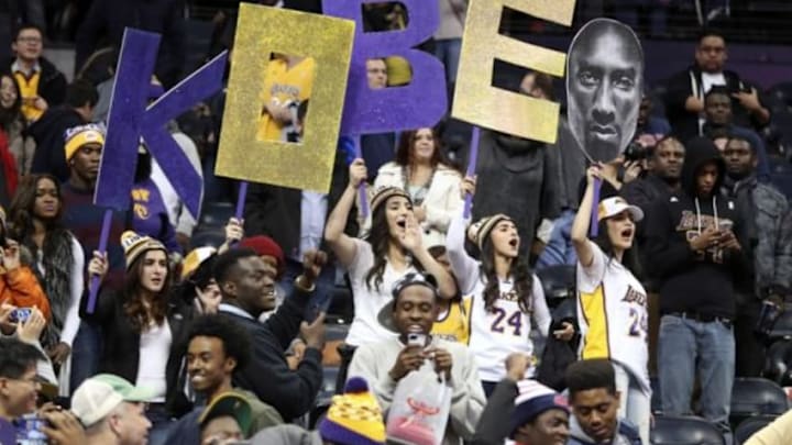 Nov 18, 2014; Atlanta, GA, USA; Fans of Los Angeles Lakers guard Kobe Bryant (not pictured) hold up a sign after the Los Angeles Lakers defeated the Atlanta Hawks at Philips Arena. The Lakers won 114-109. Mandatory Credit: Jason Getz-USA TODAY Sports
