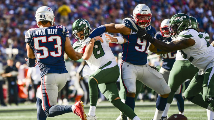 FOXBOROUGH, MA – SEPTEMBER 22: Luke Falk #8 of the New York Jets is sacked by Deatrich Wise Jr. #91 and Kyle Van Noy #53 of the New England Patriots during the fourth quarter of a game at Gillette Stadium on September 22, 2019 in Foxborough, Massachusetts. (Photo by Billie Weiss/Getty Images)