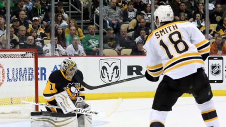 Mar 14, 2015; Pittsburgh, PA, USA; Pittsburgh Penguins goalie Thomas Greiss (1) makes a save against Boston Bruins right wing Reilly Smith (18) during the third period at the CONSOL Energy Center. Boston won 2-0. Mandatory Credit: Charles LeClaire-USA TODAY Sports