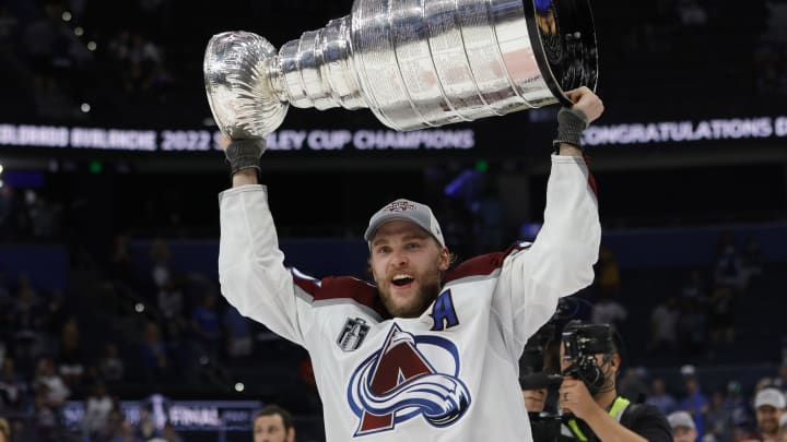 Jun 26, 2022; Tampa, Florida, USA; Colorado Avalanche right wing Mikko Rantanen (96) celebrates with the Stanley Cup after the Avalanche game against the Tampa Bay Lightning in game six of the 2022 Stanley Cup Final at Amalie Arena. Mandatory Credit: Geoff Burke-USA TODAY Sports