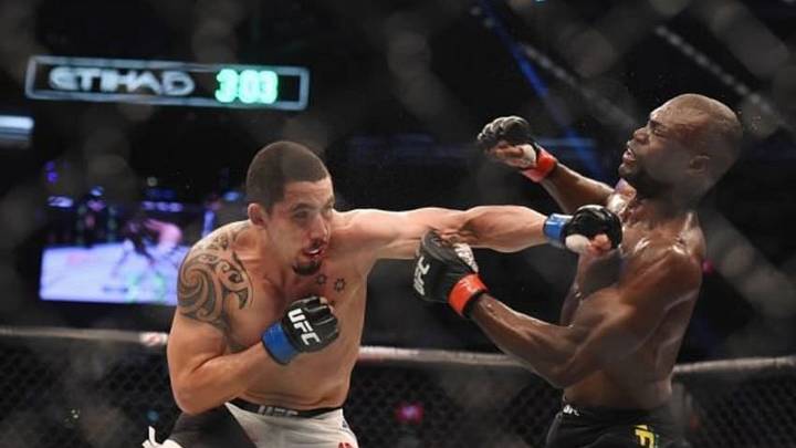 Nov 15, 2015; Melbourne, Australia; Uriah Hall (red gloves) competes against Robert Whittaker (blue gloves) during UFC 193 at Etihad Stadium. Mandatory Credit: Matt Roberts-USA TODAY Sports