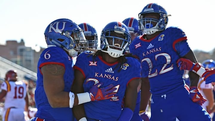 Nov 12, 2016; Lawrence, KS, USA; Kansas Jayhawks running back Tyler Patrick (4) celebrates after rushing for a touchdown against the Iowa State Cyclones during the first half at Memorial Stadium. Mandatory Credit: Peter G. Aiken-USA TODAY Sports