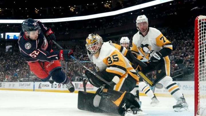 COLUMBUS, OHIO - APRIL 13: Tristan Jarry #35 of the Pittsburgh Penguins deflects a shot from Emil Bemstrom #52 of the Columbus Blue Jackets during the second period at Nationwide Arena on April 13, 2023 in Columbus, Ohio. (Photo by Jason Mowry/Getty Images)