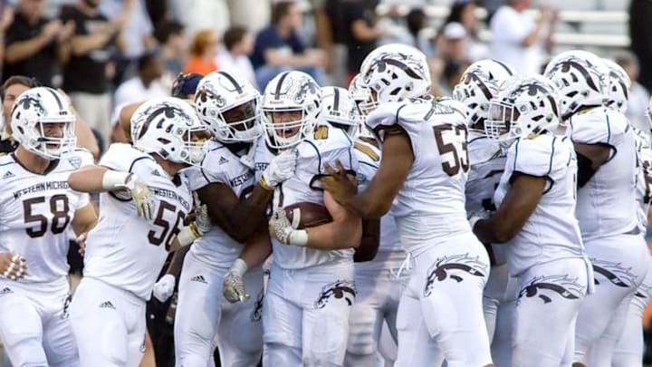 Sep 17, 2016; Champaign, IL, USA; The Western Michigan Broncos defense celebrates after the interception by Western Michigan Broncos linebacker Robert Spillane (10) during the fourth quarter at Memorial Stadium. Western Michigan beat Illinois 34 to 10. Mandatory Credit: Mike Granse-USA TODAY Sports