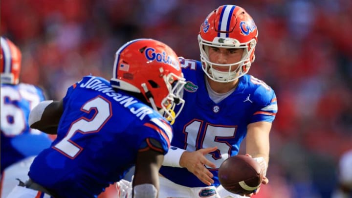 Florida Gators quarterback Graham Mertz (15) hands off to running back Montrell Johnson Jr. (2) during the first quarter of an NCAA football game Saturday, Oct. 28, 2023 at EverBank Stadium in Jacksonville, Fla. Georgia defeated Florida 43-20. [Corey Perrine/Florida Times-Union]