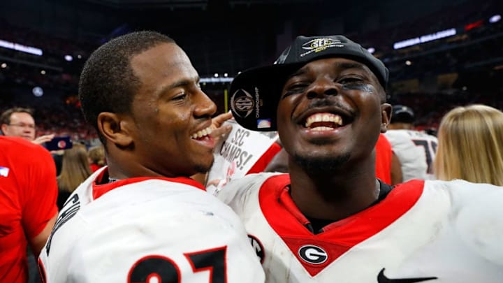 ATLANTA, GA - DECEMBER 02: Nick Chubb No. 27 and Sony Michel No. 1 celebrate beating the Auburn Tigers in the SEC Championship at Mercedes-Benz Stadium on December 2, 2017 in Atlanta, Georgia. (Photo by Kevin C. Cox/Getty Images)