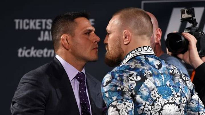 LAS VEGAS, NV - JANUARY 20: Rafael dos Anjos of Brazil (L) and Conor McGregor of Ireland (R) face off during the UFC 197 on-sale press conference event inside MGM Grand Hotel