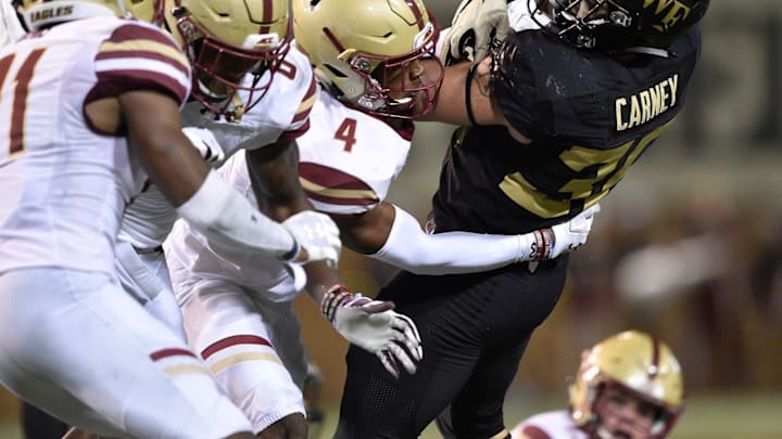 WINSTON SALEM, NC – SEPTEMBER 13: Hamp Cheevers #4 of the Boston College Eagles tackles Cade Carney #36 of the Wake Forest Demon Deacons during their game at BB&T Field on September 13, 2018 in Winston Salem, North Carolina. (Photo by Grant Halverson/Getty Images)