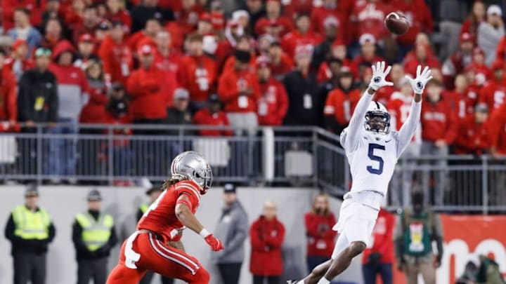 Penn State Nittany Lions wide receiver Jahan Dotson (5) catches a pass behind Ohio State Buckeyes safety Ronnie Hickman (14) during the fourth quarter of the NCAA football game at Ohio Stadium in Columbus on Sunday, Oct. 31, 2021.Penn State At Ohio State Football
