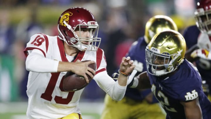 SOUTH BEND, IN - OCTOBER 21: Matt Fink #19 of the USC Trojans runs the ball against Julian Okwara #42 of the Notre Dame Fighting Irish in the third quarter of a game at Notre Dame Stadium on October 21, 2017 in South Bend, Indiana. Notre Dame won 49-14. (Photo by Joe Robbins/Getty Images)
